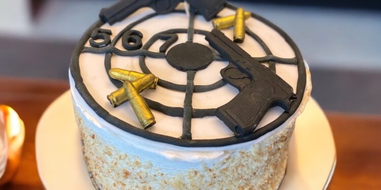 Man makes use of gun to reduce birthday cake through shooting it